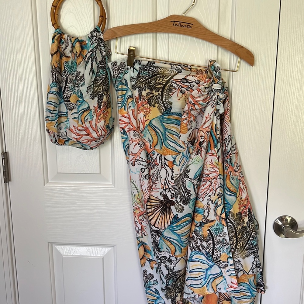 Chicos sarong and purse beach attire.
